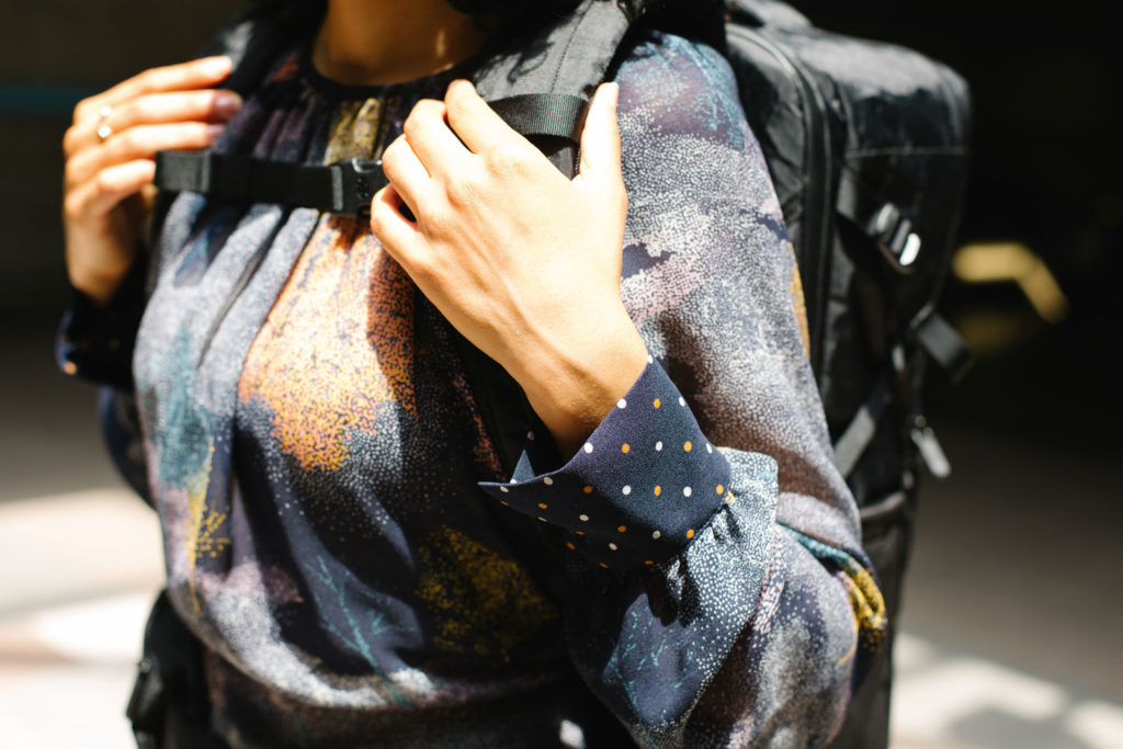 Woman's colorful shirt in shadows