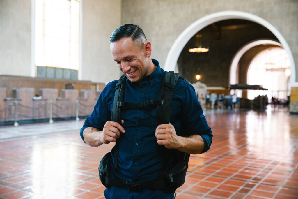 Man wearing backpack at Union Station in Los Angeles