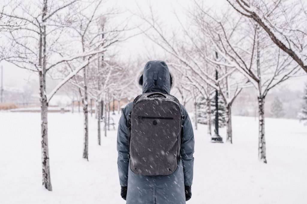 Wearing a parka and travel backpack in Salt Lake City, Utah