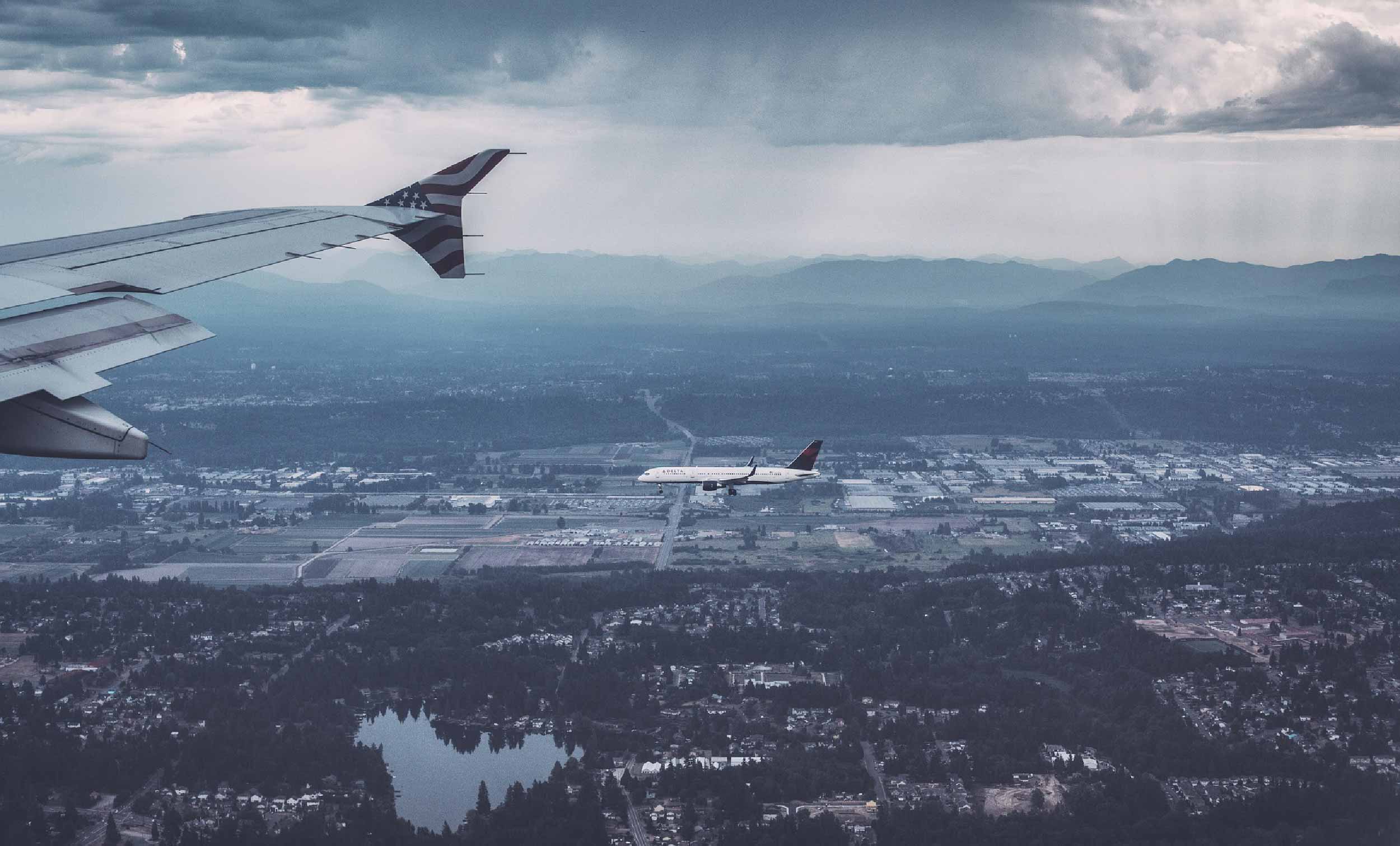 a plane's wing flying at dusk