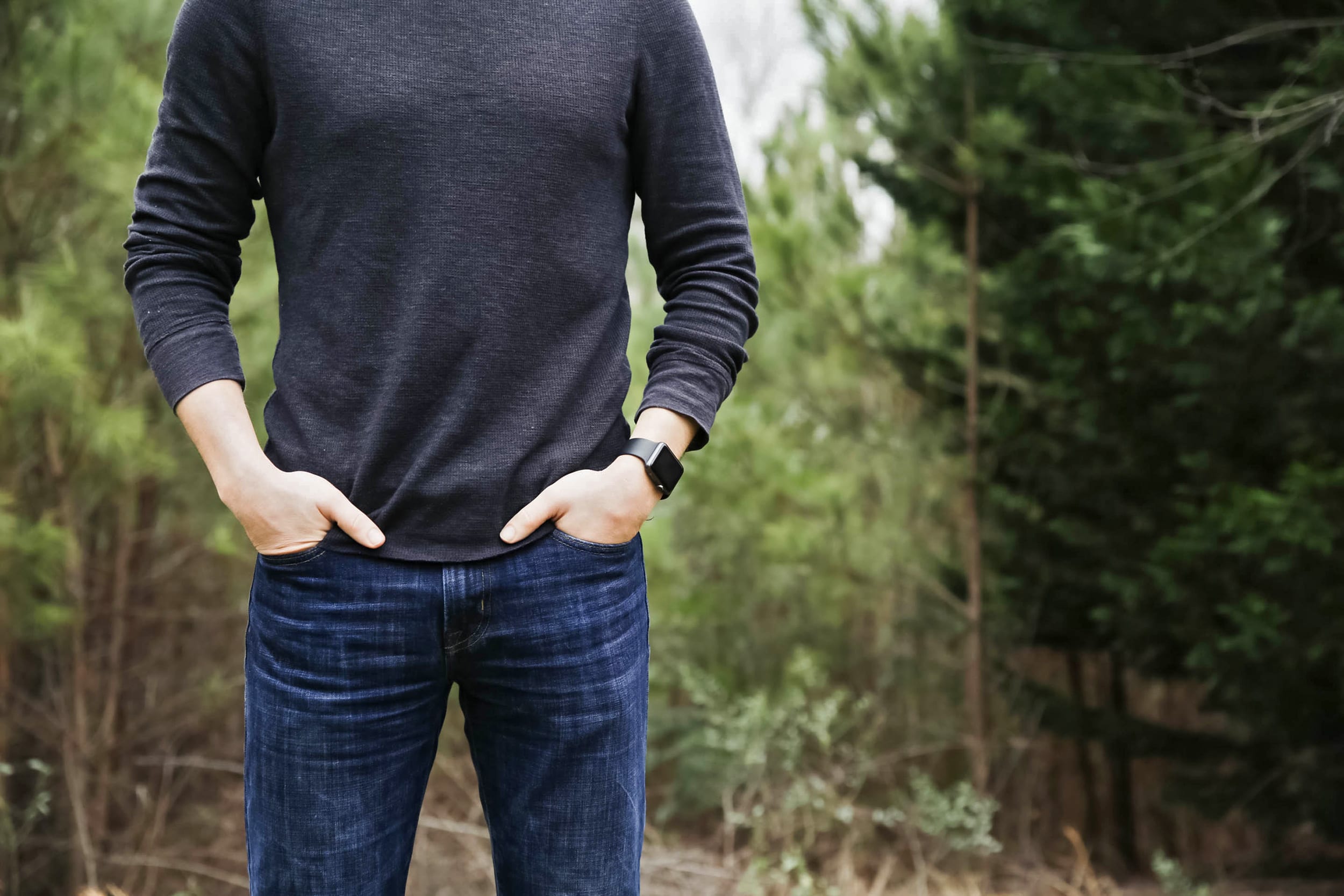 Man wearing sweater with hands in his pockets
