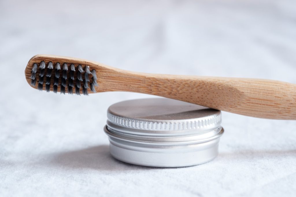 Toothbrush and metal container