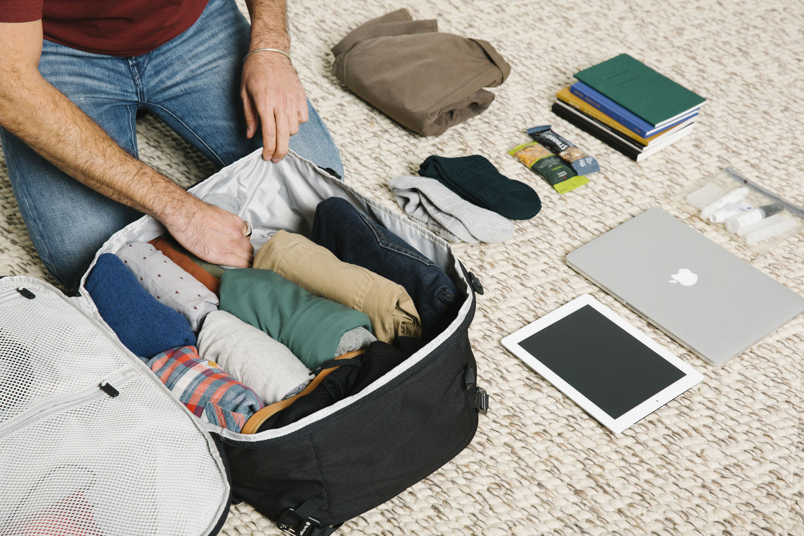 Man packing a capsule wardrobe