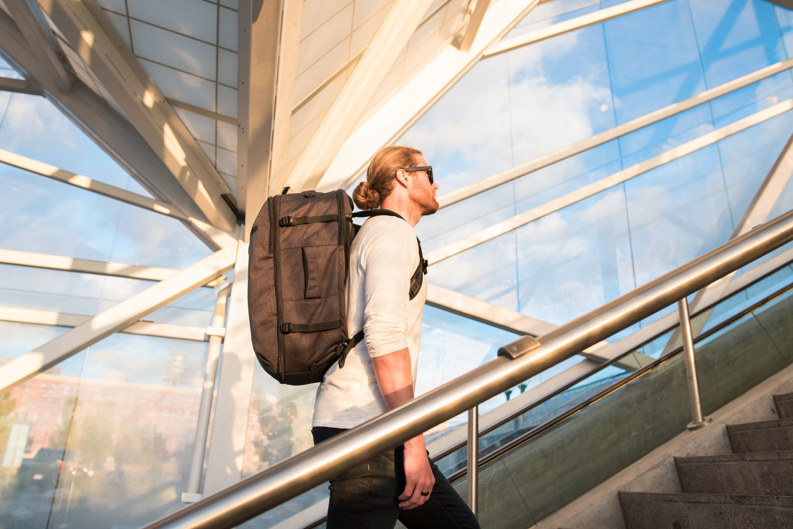 Man walking up stairs at an airport