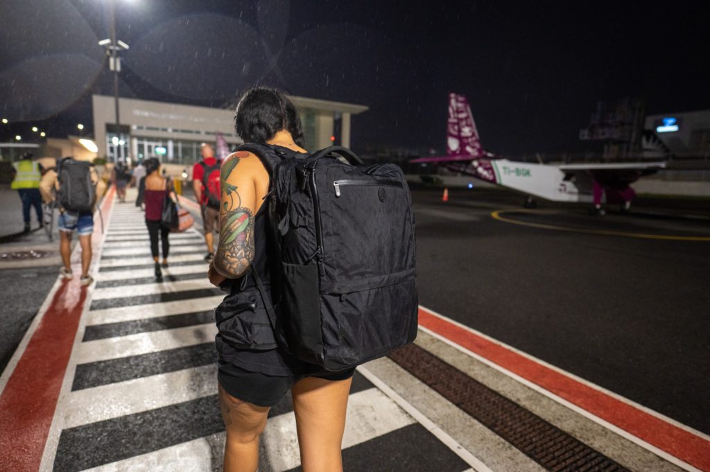 Wearing travel backpack at a small airport