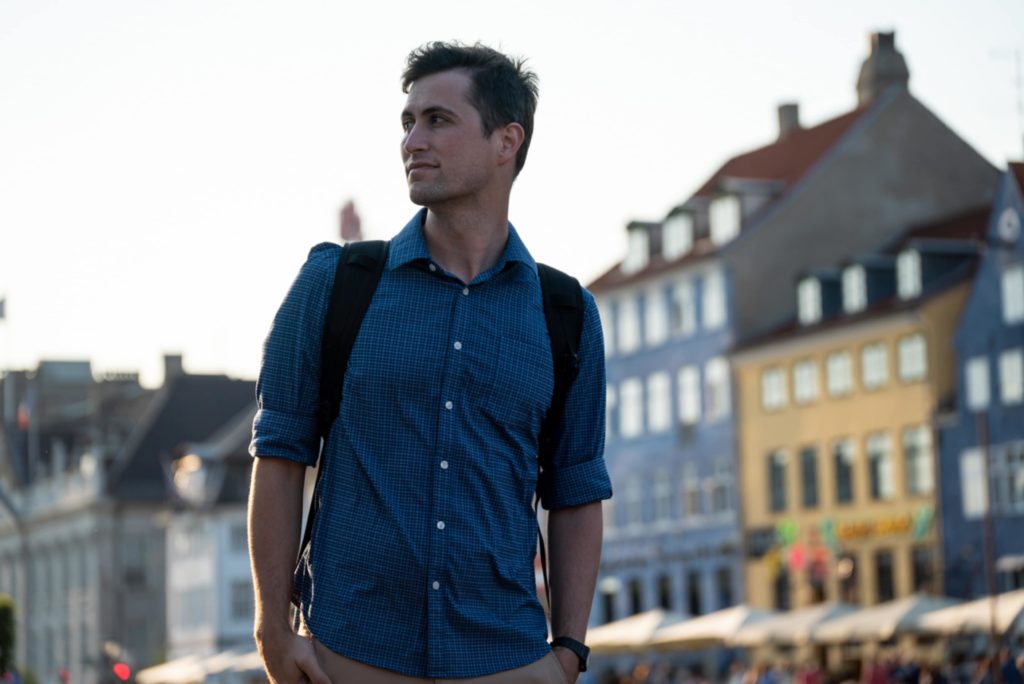 Man in Amsterdam wearing a travel backpack