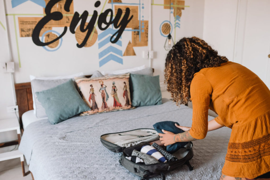 A woman packing for her next trip.