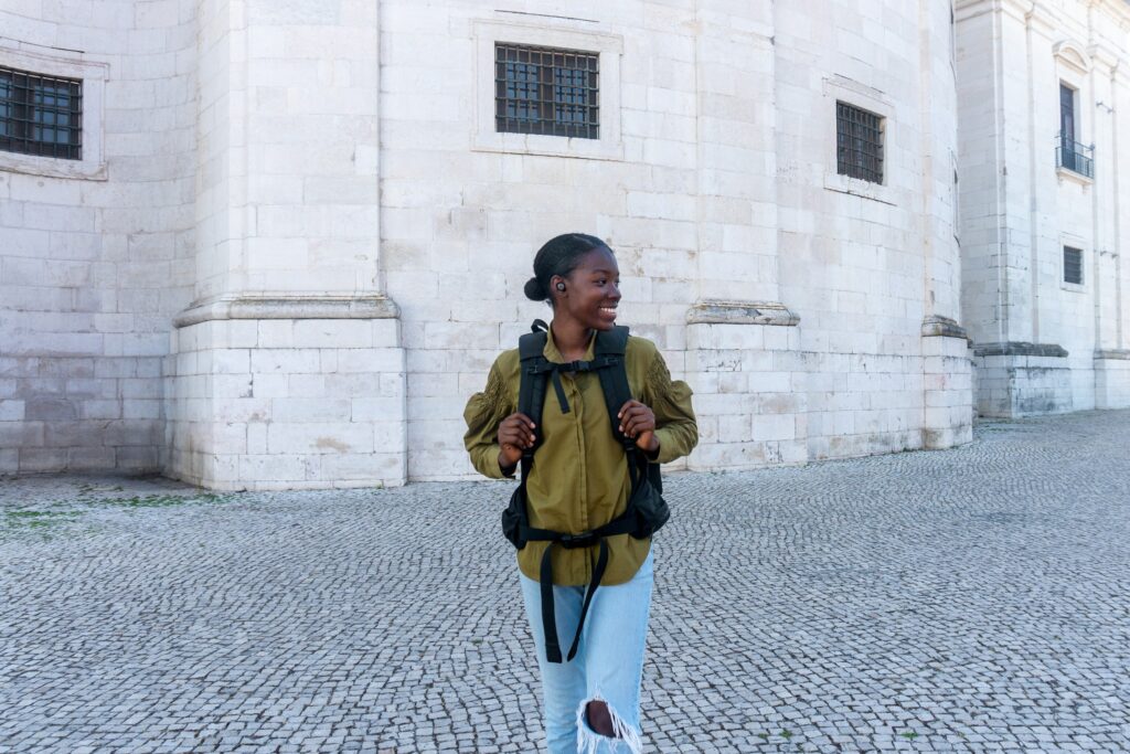 Woman wearing jeans and long sleeves in Lisbon Portugal