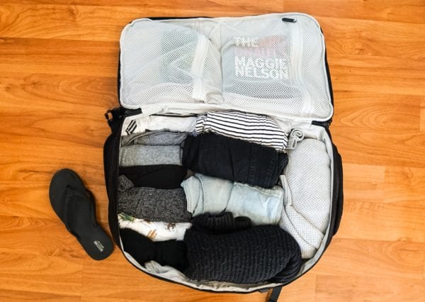 Rolling clothes to pack in suitcase online